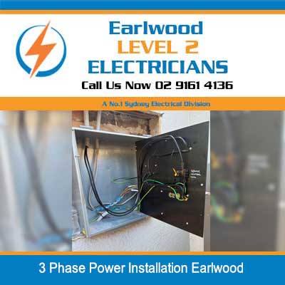 Level 2 electrician installing 3 phase power wiring and circuit breakers in electrical panel at Earlwood