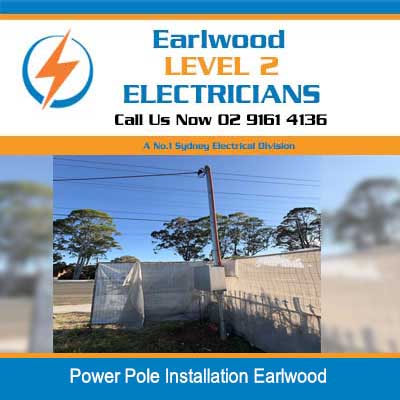Level 2 electrician installing new private power pole for home electrical supply in Earlwood