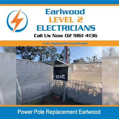 Level 2 electrician replacing damaged power pole at residential electricity connection in Earlwood